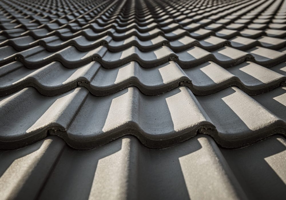 Black Ceramic Roof Tiles Pattern. House Roofing. Construction Industry Materials.